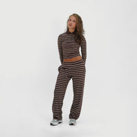 Model wearing the Soho Top in Brown Stripe with the matching striped trousers, full-length front view