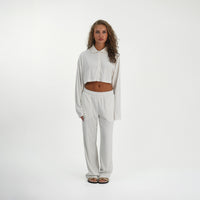 Model wearing the Soft Towelling Top and Trousers set in White, front view showing the collar and cropped top