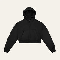 Core Hoodie in Black laid flat from the front, showing the cropped length, tonal full zip and front pocket
