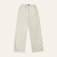Joggers in Bone laid flat from the front, showing the elasticated waist, zip pockets and straight-cut leg