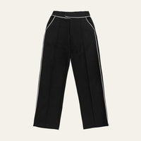 Contrast Piping Trousers in black laid flat, front view showing the white piping along the pockets and legs